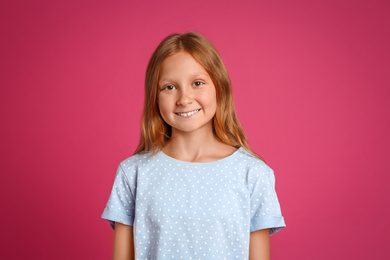 Photo of Portrait of preteen girl on pink background