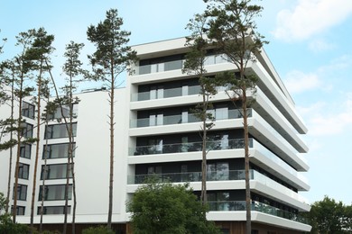 Photo of View of modern house with glass railings on balconies