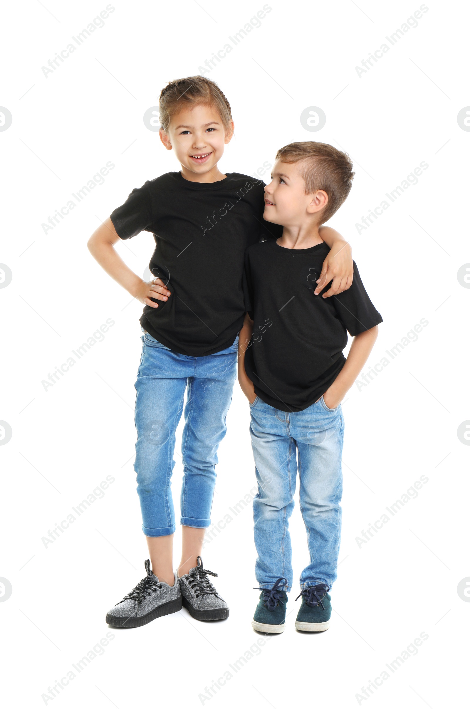 Photo of Little kids in t-shirts on white background. Mockup for design