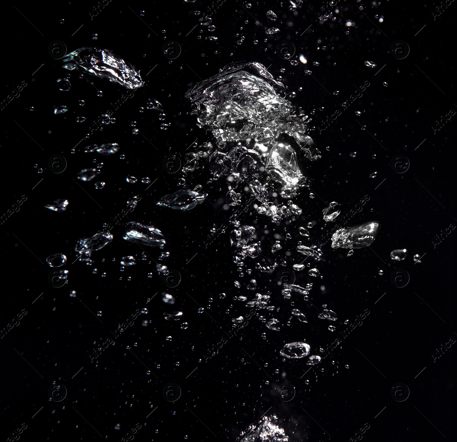 Image of Many air bubbles in water on black background