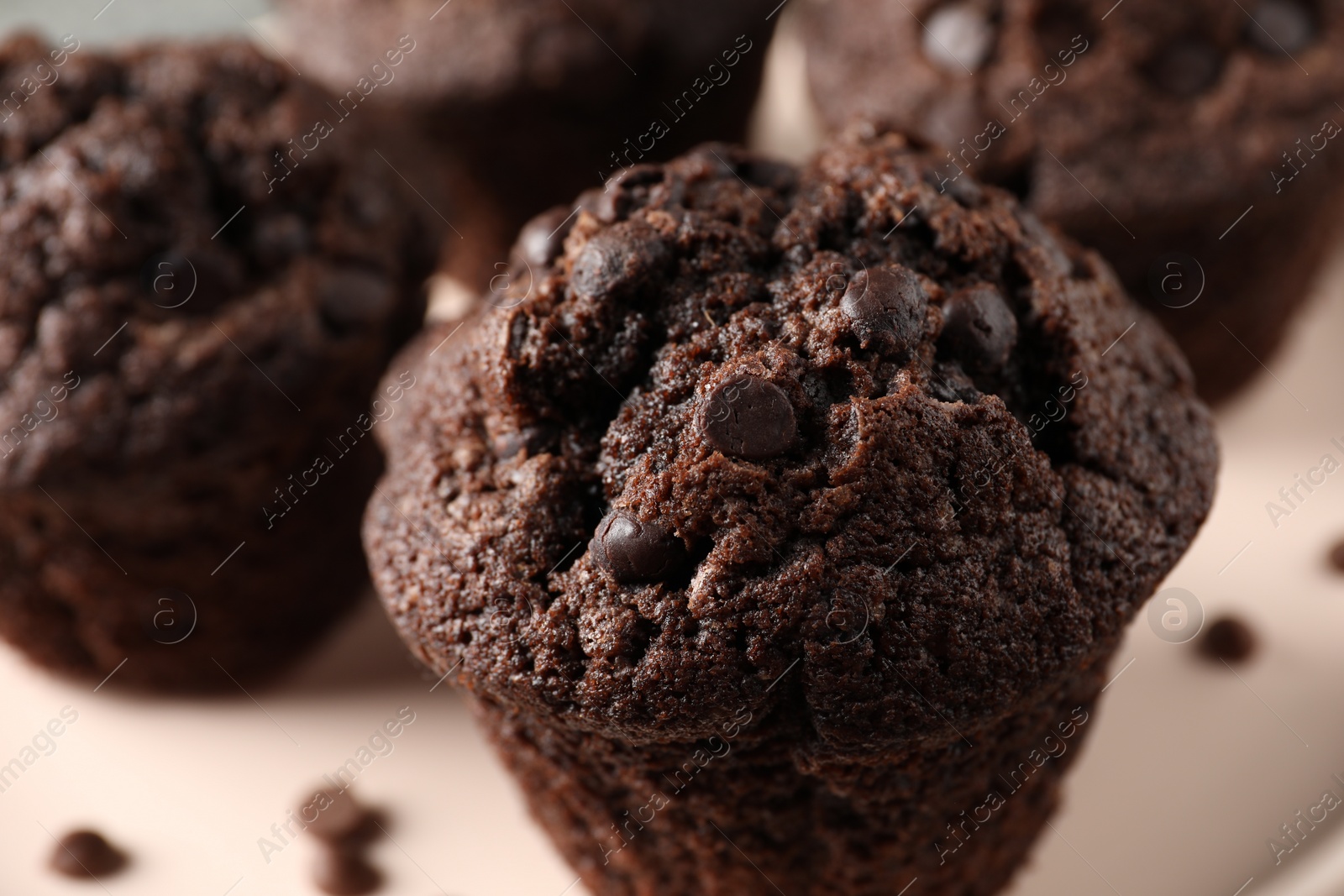 Photo of Delicious fresh chocolate muffins on table, closeup