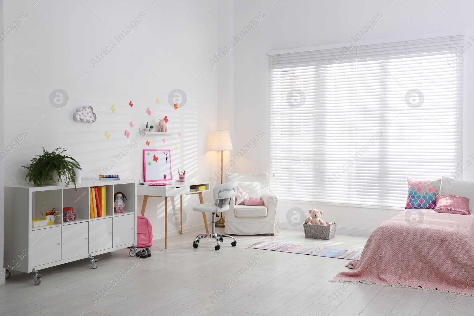 Photo of Modern child room interior with stylish furniture