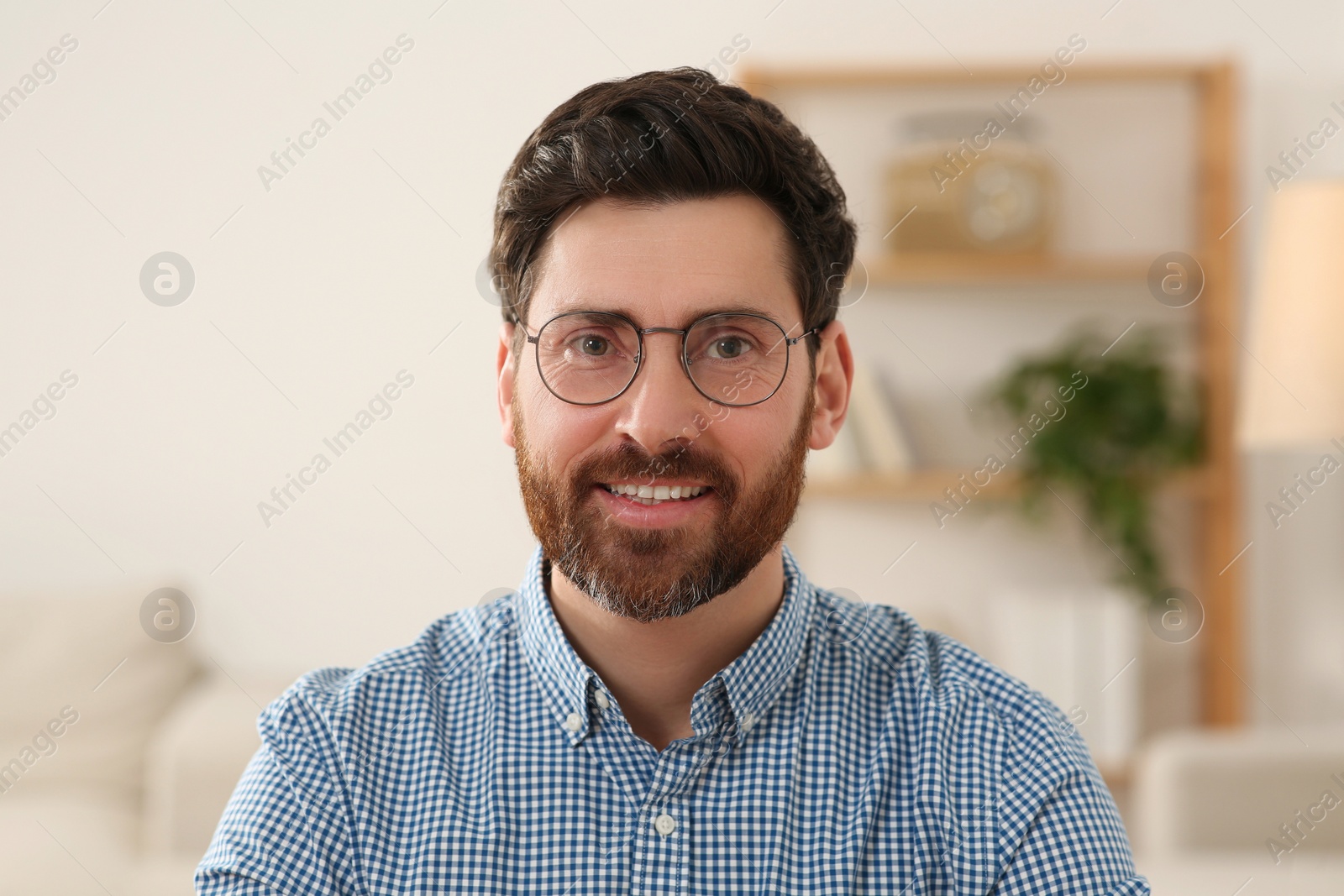 Photo of Happy man having video call at home, view from web camera