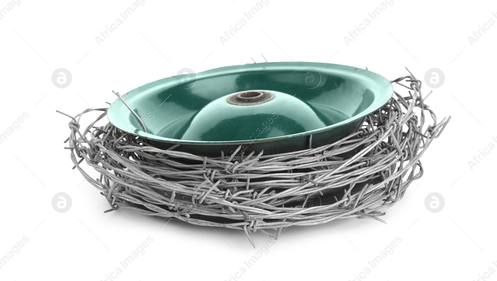 Photo of Coil of metal barbed wire isolated on white