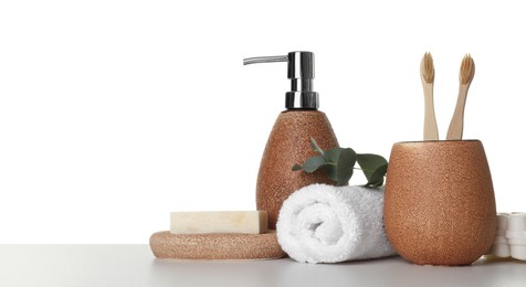 Bath accessories. Different personal care products and eucalyptus branch on table against white background. Space for text