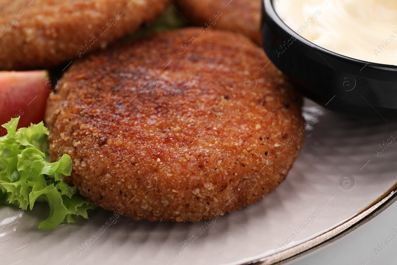 Photo of Delicious vegan cutlets on plate, closeup view