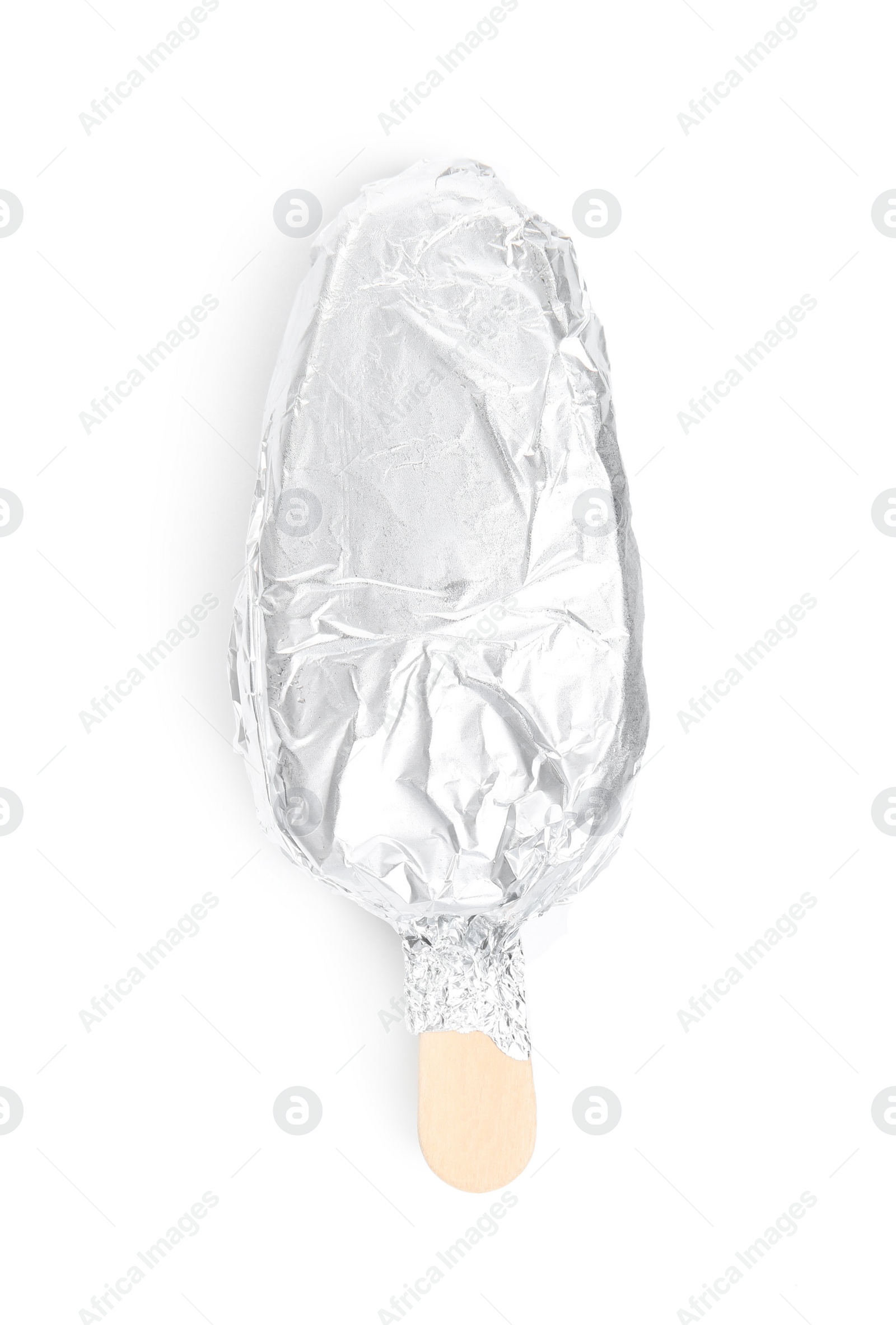 Photo of Ice cream bar wrapped in foil on white background, top view