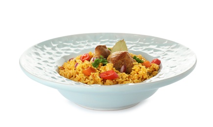 Photo of Plate with rice pilaf and meat on white background