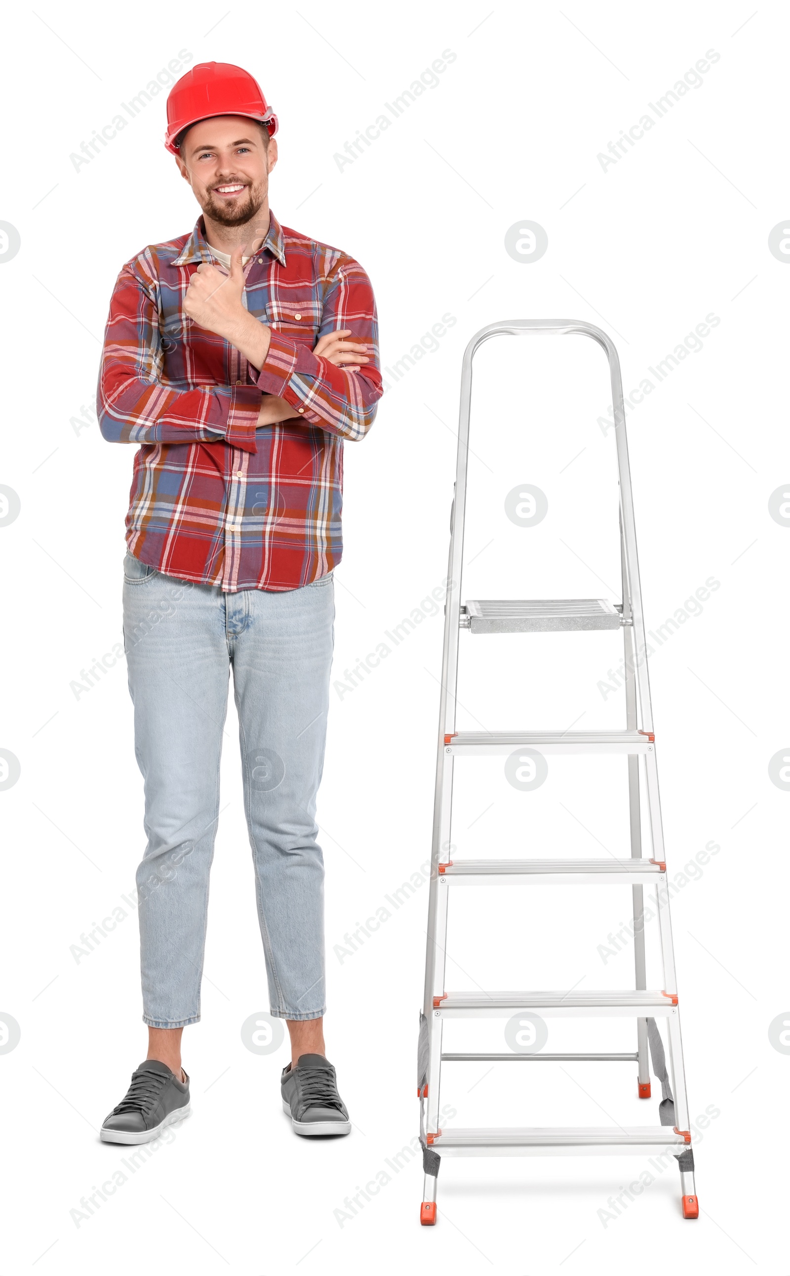 Photo of Young handsome man in hard hat near metal ladder on white background