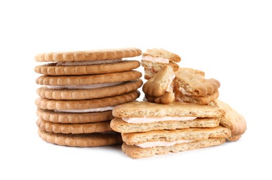 Photo of Tasty sandwich cookies with cream on white background