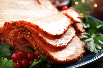 Photo of Delicious ham served with garnish on plate, closeup
