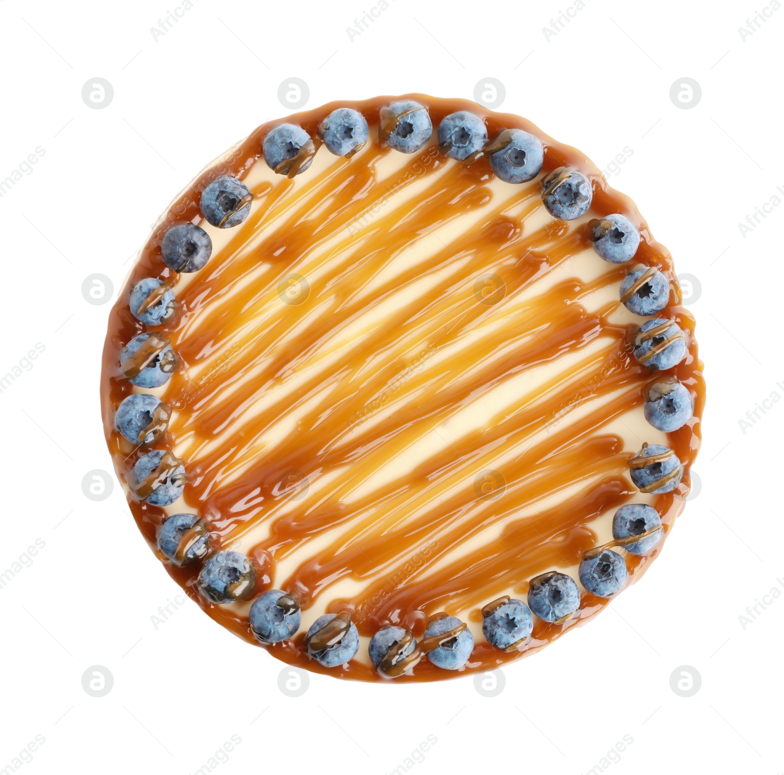 Photo of Delicious cheesecake with caramel and blueberries isolated on white, top view