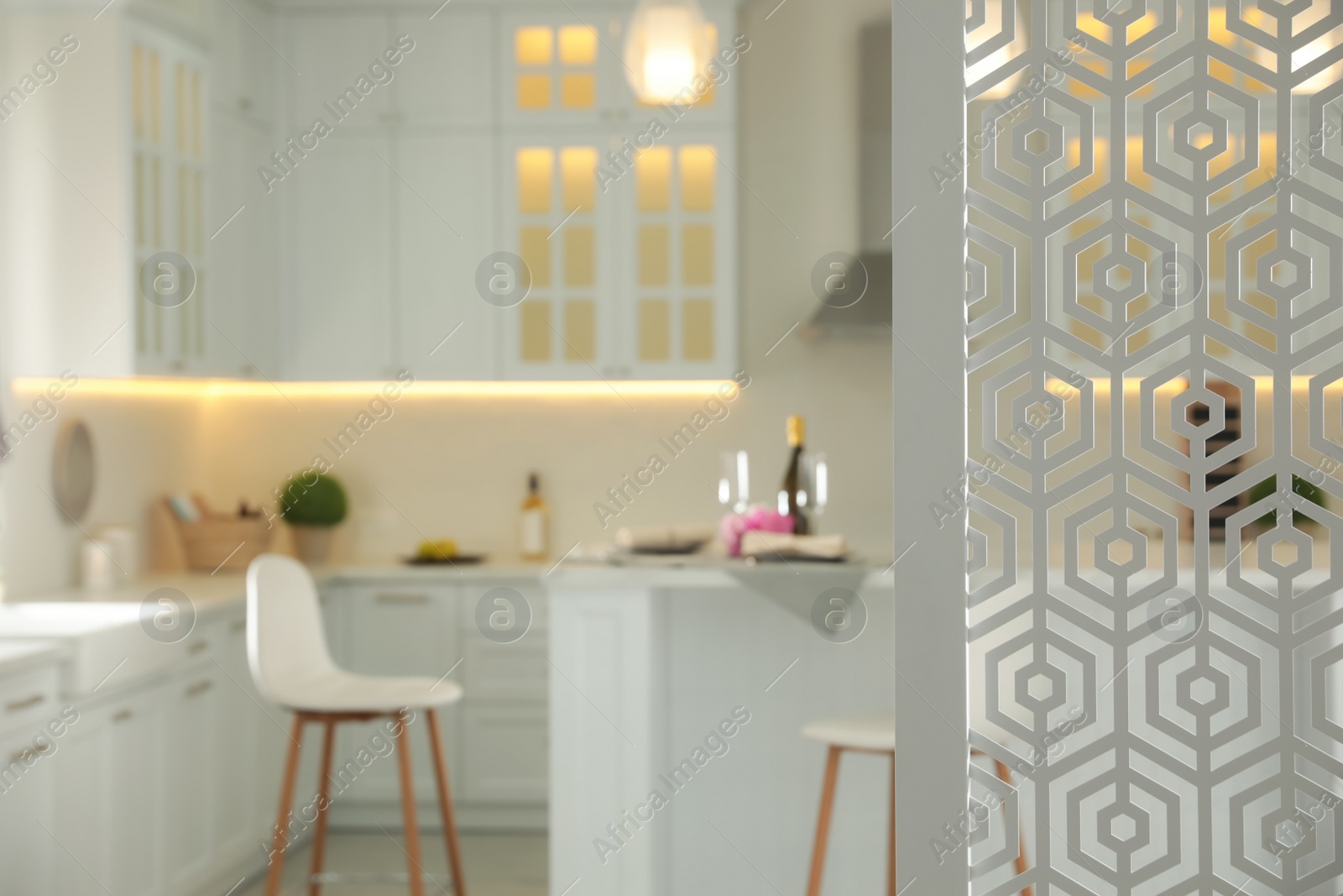 Photo of Blurred view of modern kitchen interior with stylish furniture, focus on partition