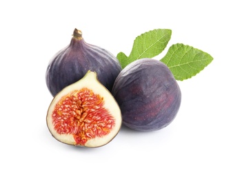 Whole and cut purple figs on white background