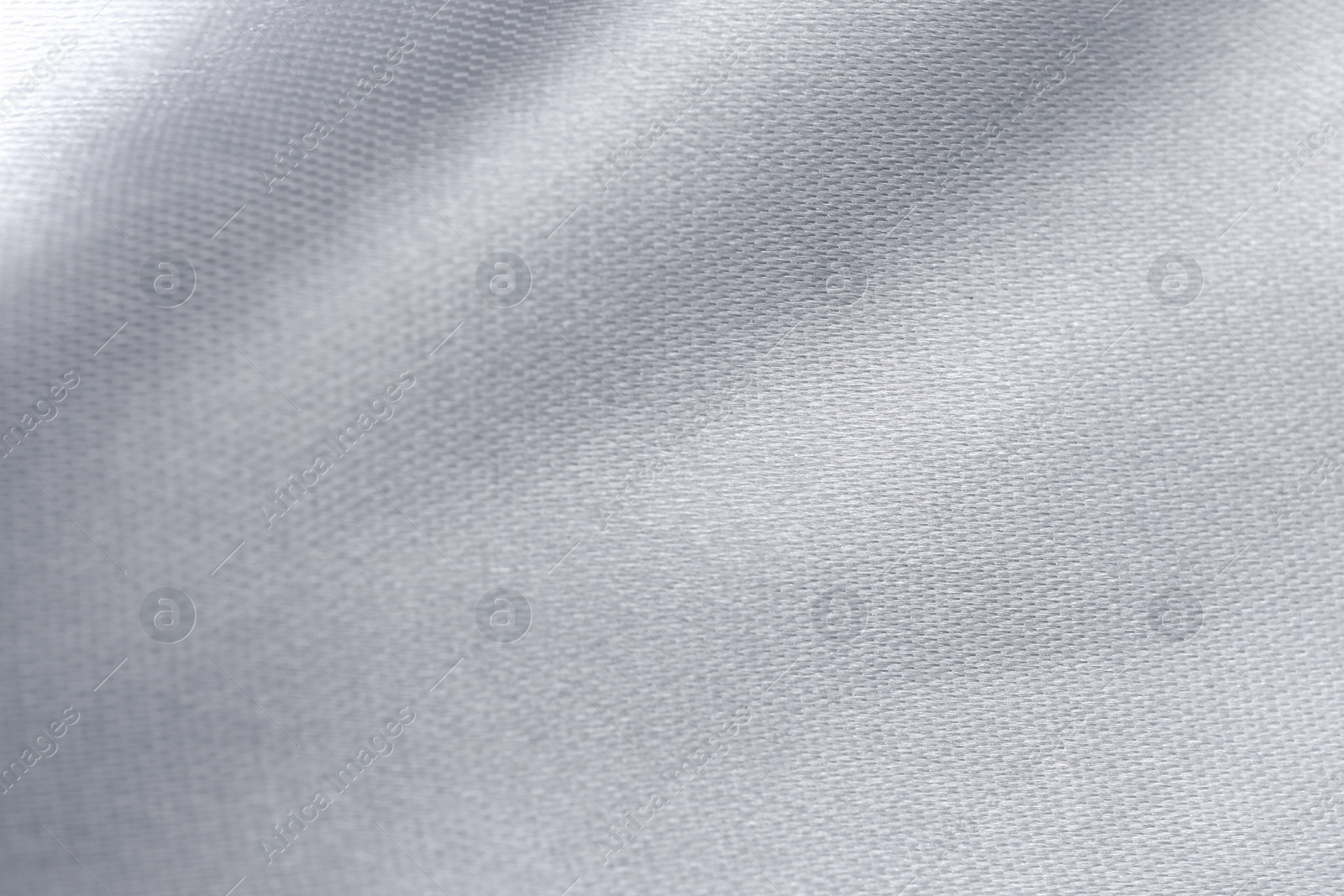 Photo of Closeup view of silver fabric as background