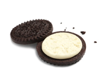 Tasty chocolate cookie with cream on white background