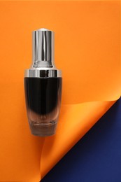 Photo of Blank bottle of perfume on color background