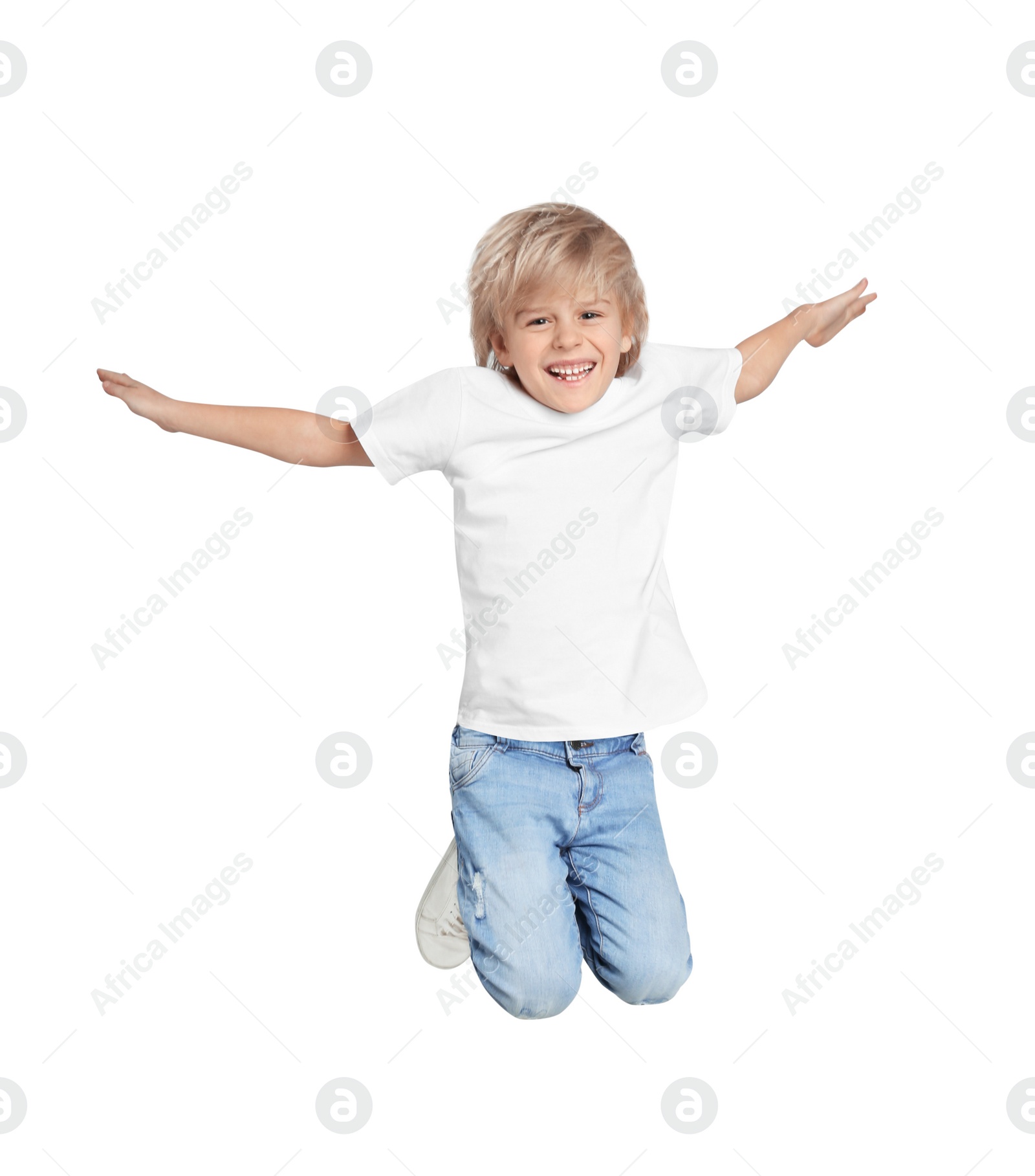 Photo of Happy little boy jumping on light grey background