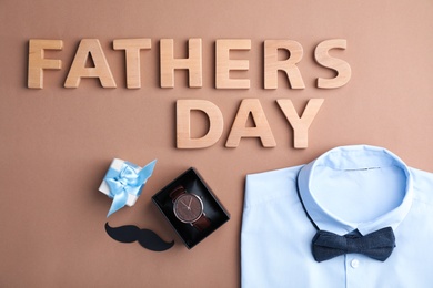 Flat lay composition with male accessories and shirt on color background. Happy Father's Day