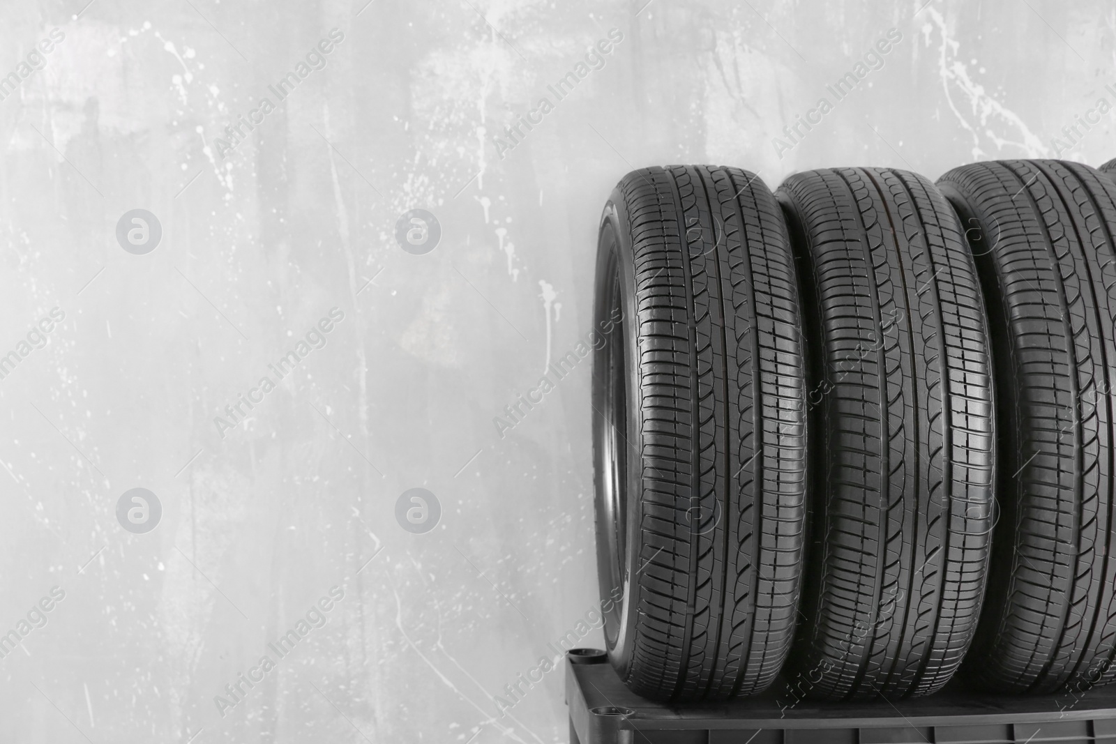 Photo of Car tires on grey background