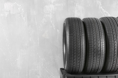 Car tires on grey background