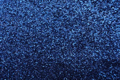 Beautiful shiny blue glitter as background, closeup