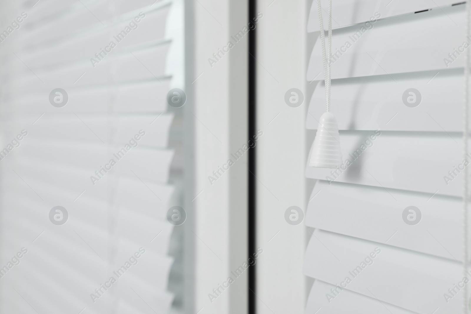 Photo of Closeup view of stylish horizontal window blinds