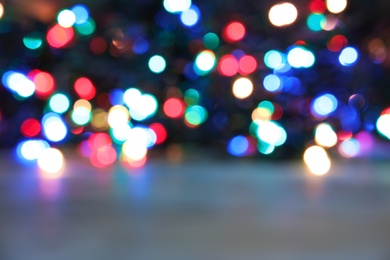 Blurred view of Christmas lights on table