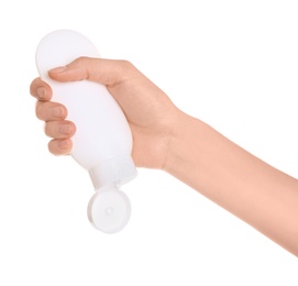 Photo of Young woman holding bottle with hand cream on white background