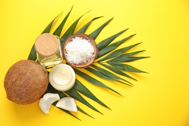 Photo of Beautiful composition with coconut oil and nuts on color background