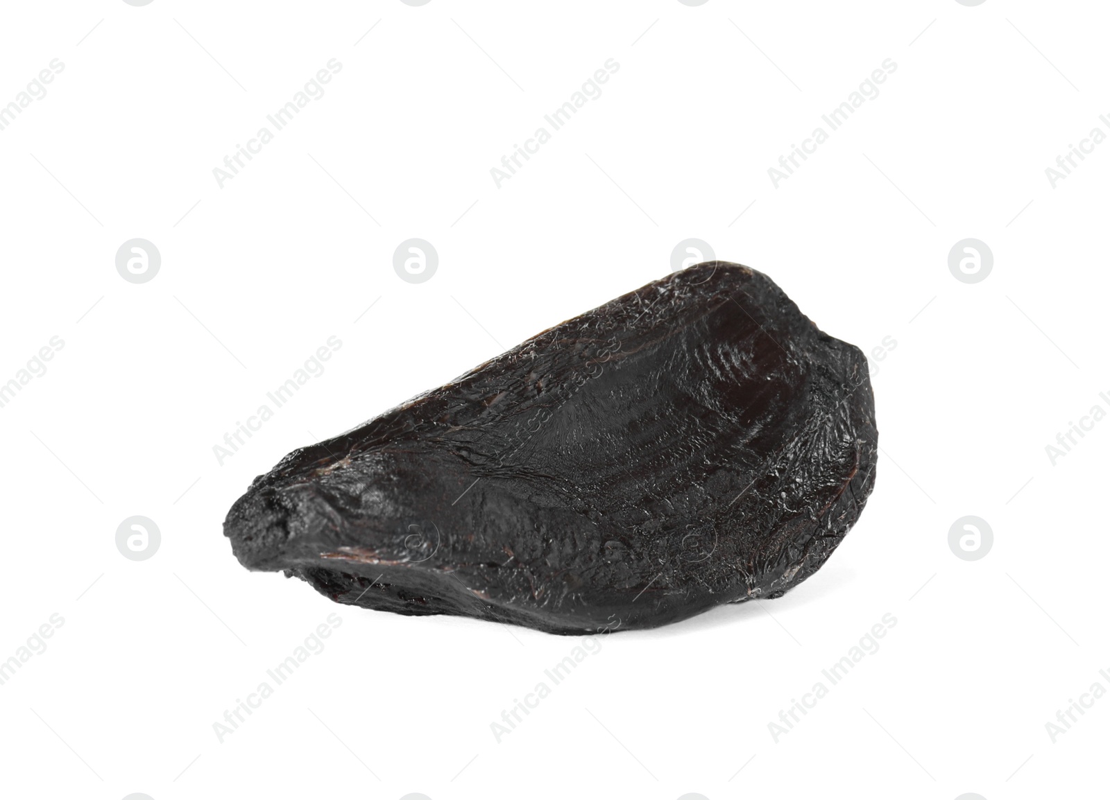 Photo of Clove of aged black garlic on white background