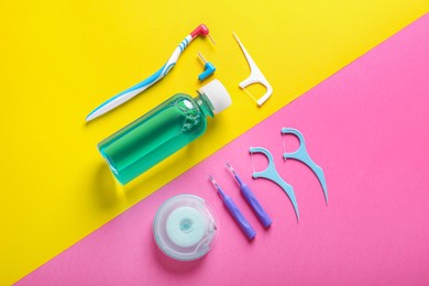 Photo of Flat lay composition with dental floss and different teeth care products on color background