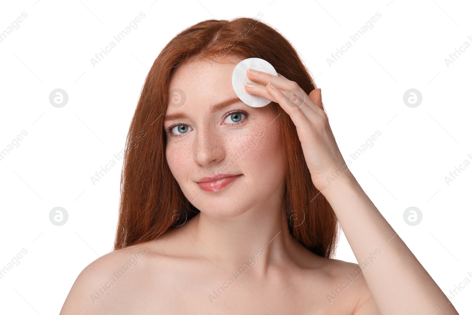 Photo of Beautiful woman with freckles wiping face on white background