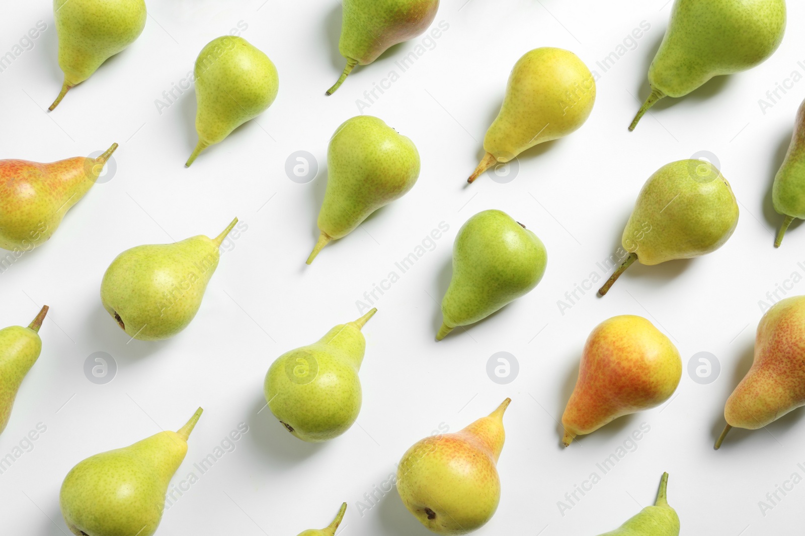 Photo of Ripe juicy pears on white background, top view