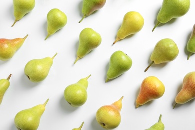 Ripe juicy pears on white background, top view