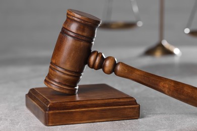 Photo of Law concept. Judge's gavel on light grey table, closeup