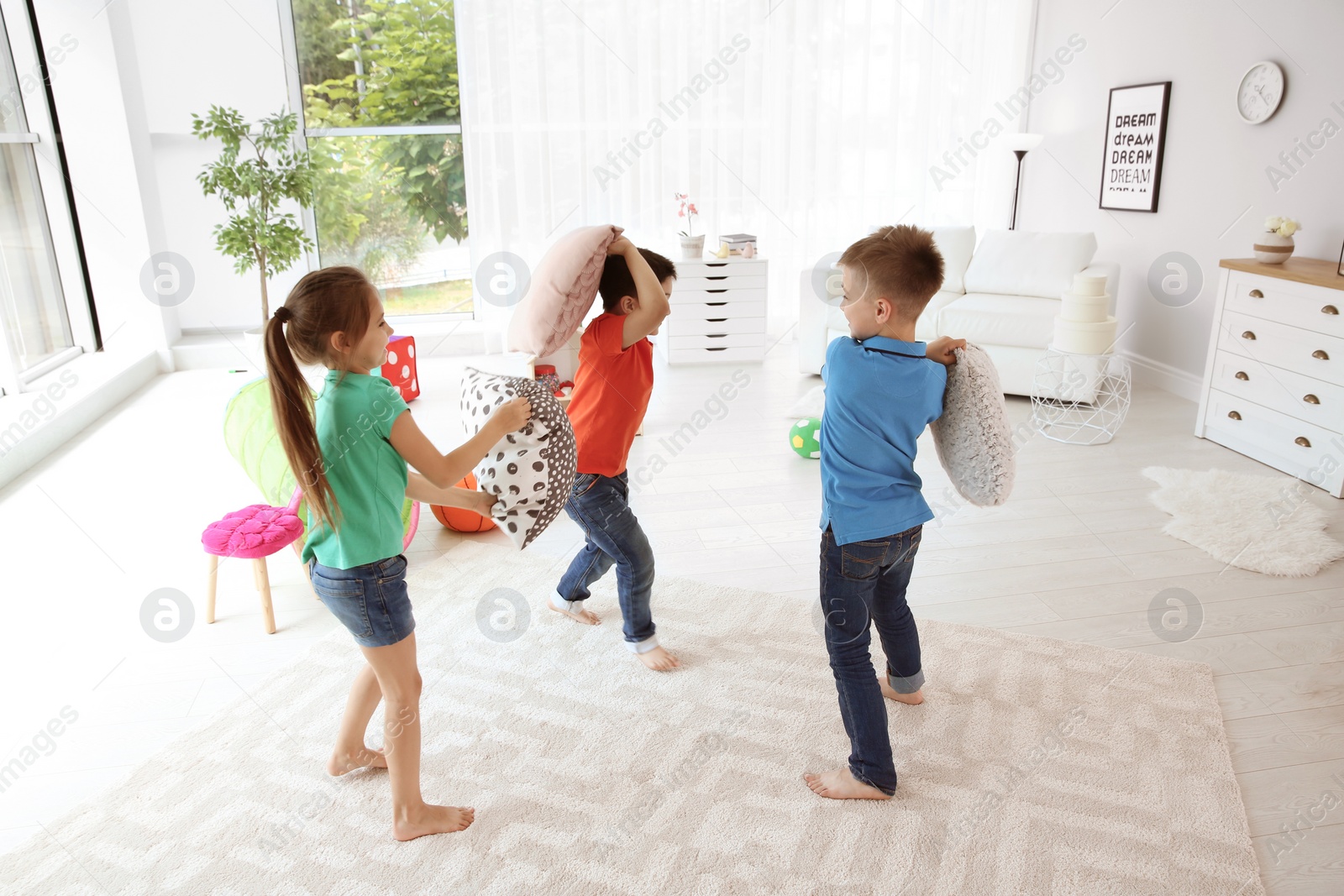 Photo of Cute little children playing together, indoors