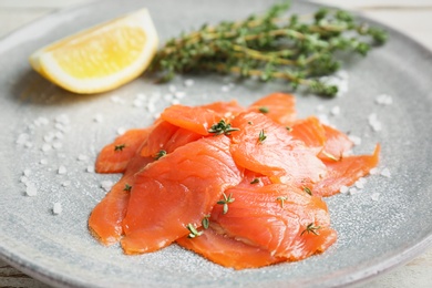 Photo of Plate with fresh sliced salmon fillet, closeup