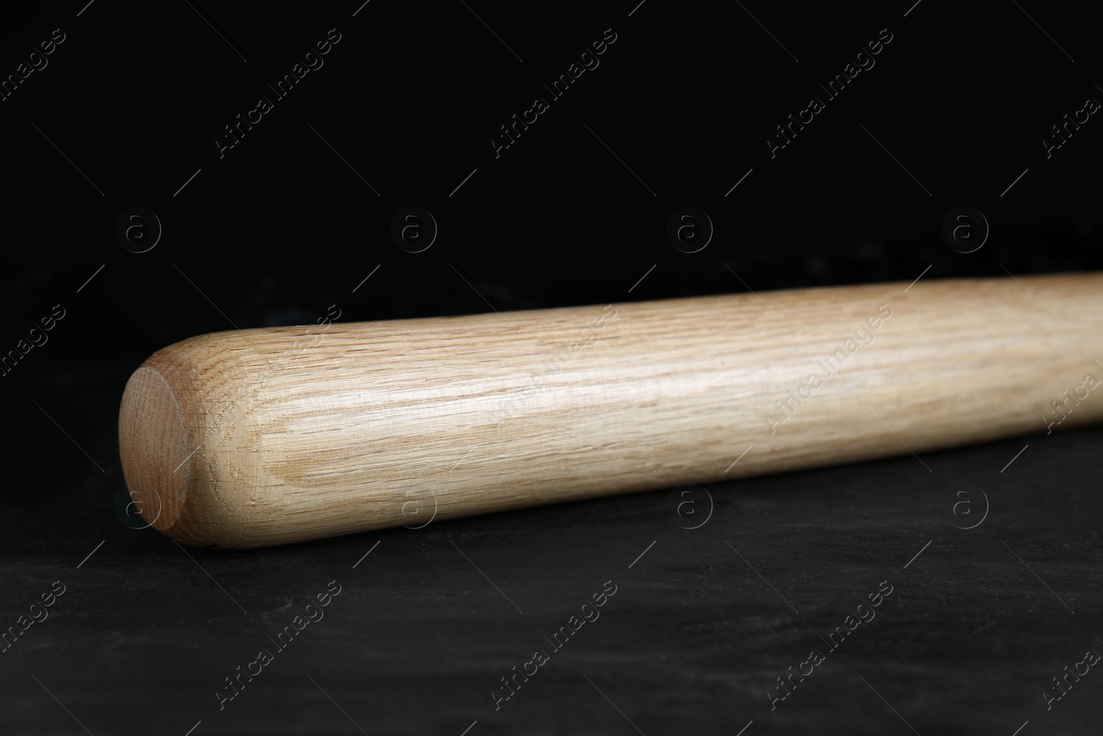 Photo of Baseball bat on black background. Sports equipment