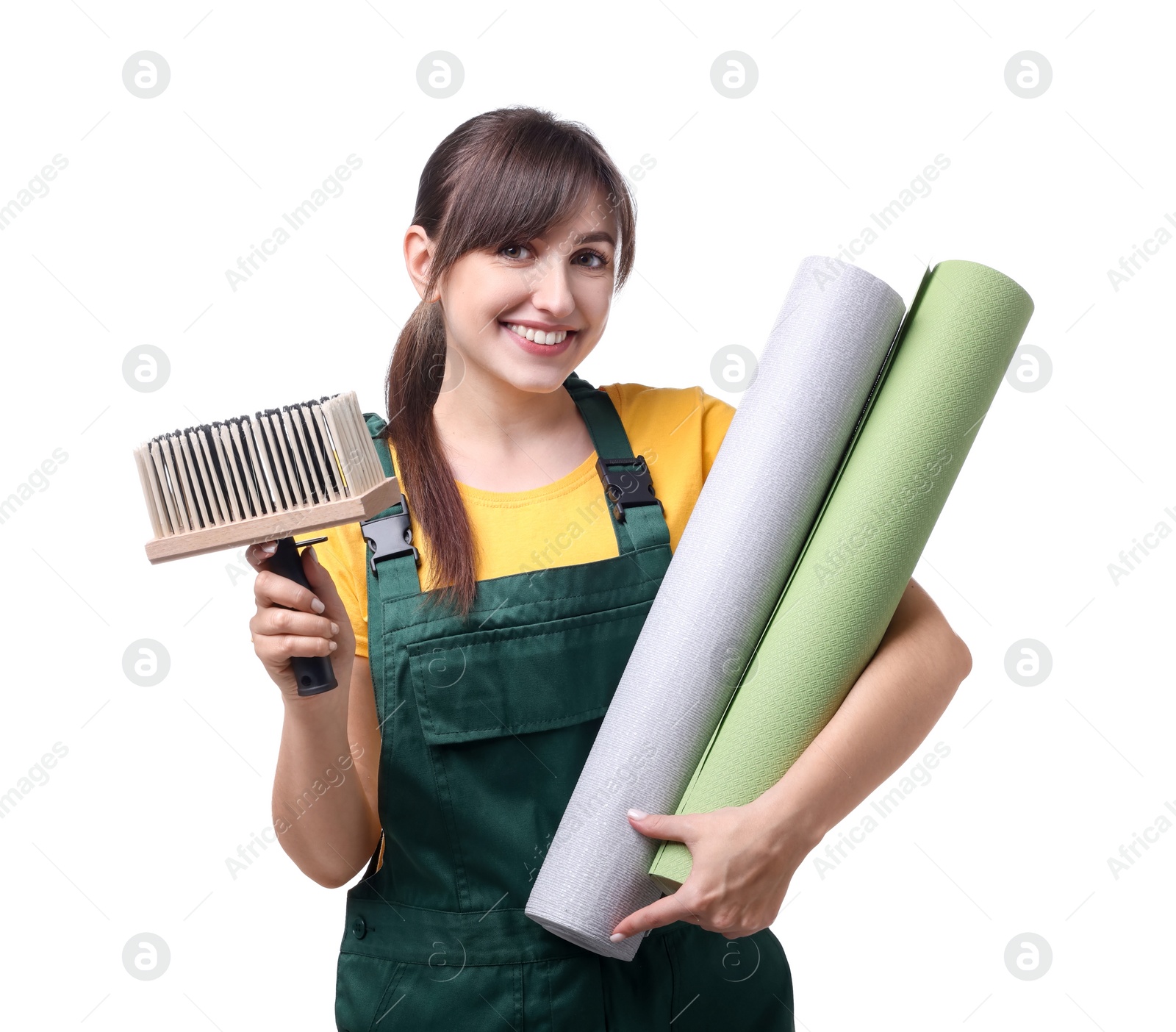 Photo of Beautiful woman with wallpaper rolls and brush on white background