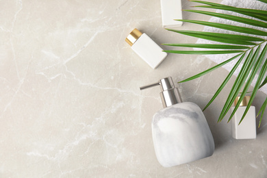 Photo of Flat lay composition with soap dispenser on marble background. Space for text