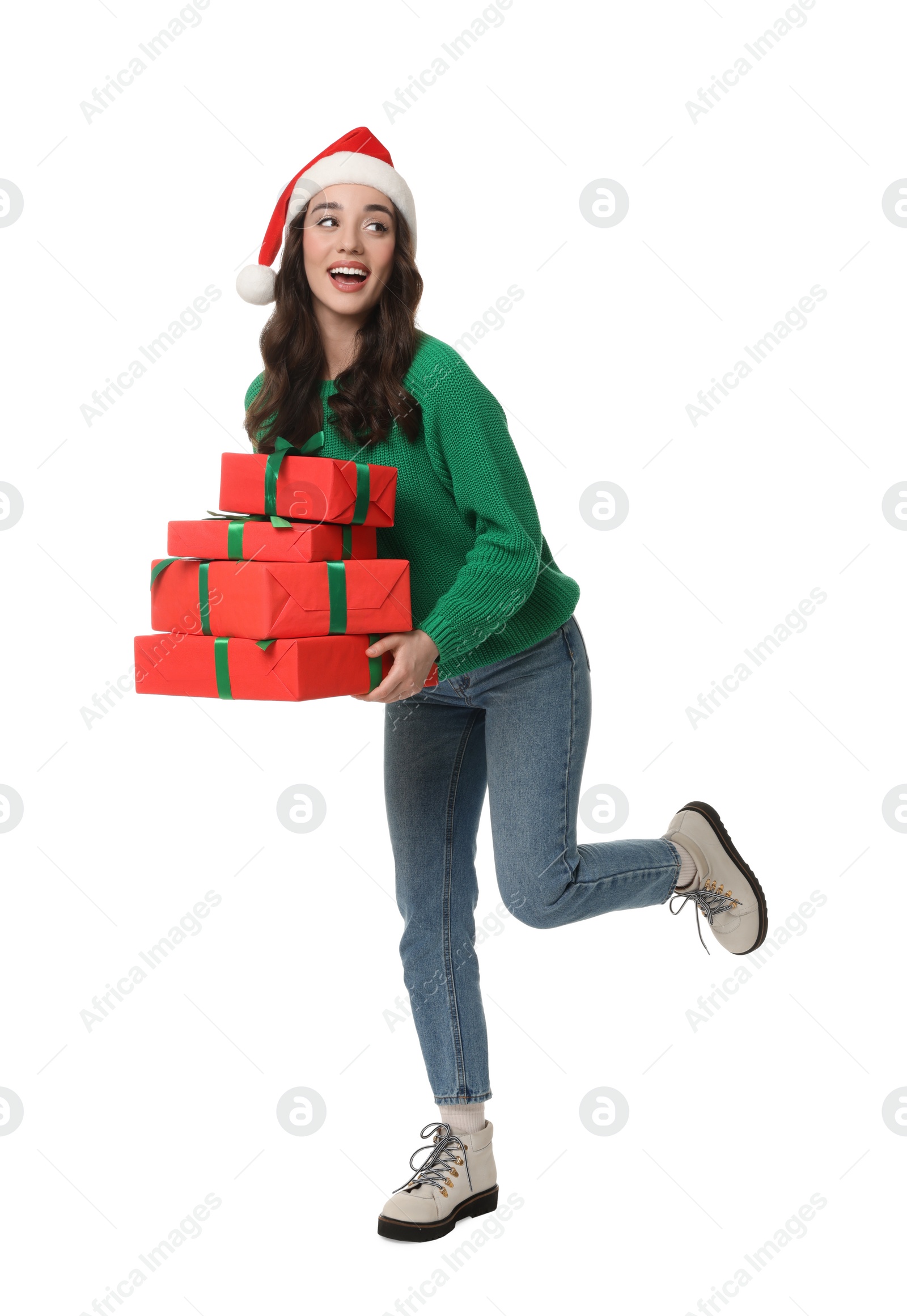 Photo of Beautiful young woman in Santa hat with Christmas gifts isolated on white
