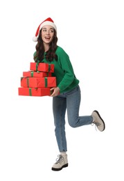 Photo of Beautiful young woman in Santa hat with Christmas gifts isolated on white