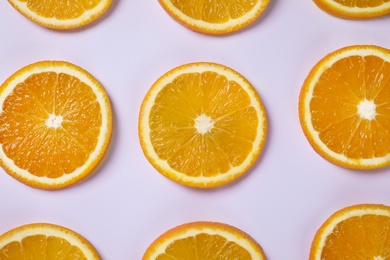 Fresh orange slices on light background, flat lay