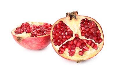 Photo of Halves of fresh pomegranate isolated on white