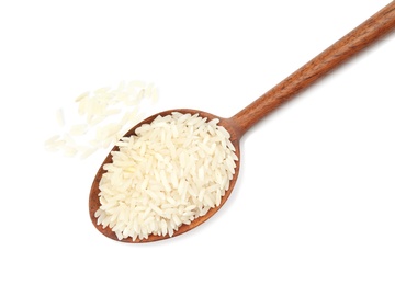 Photo of Spoon with uncooked rice on white background, top view