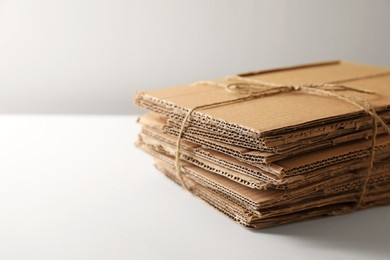 Photo of Stack of waste paper on beige background, closeup. Space or text