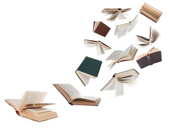 Image of Many hardcover books flying on white background