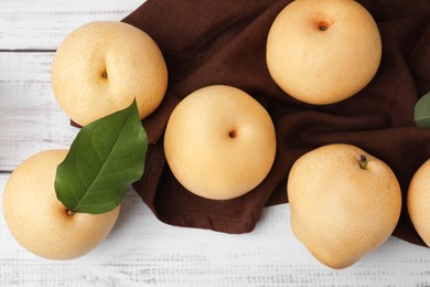 Photo of Delicious apple pears on white wooden table, flat lay