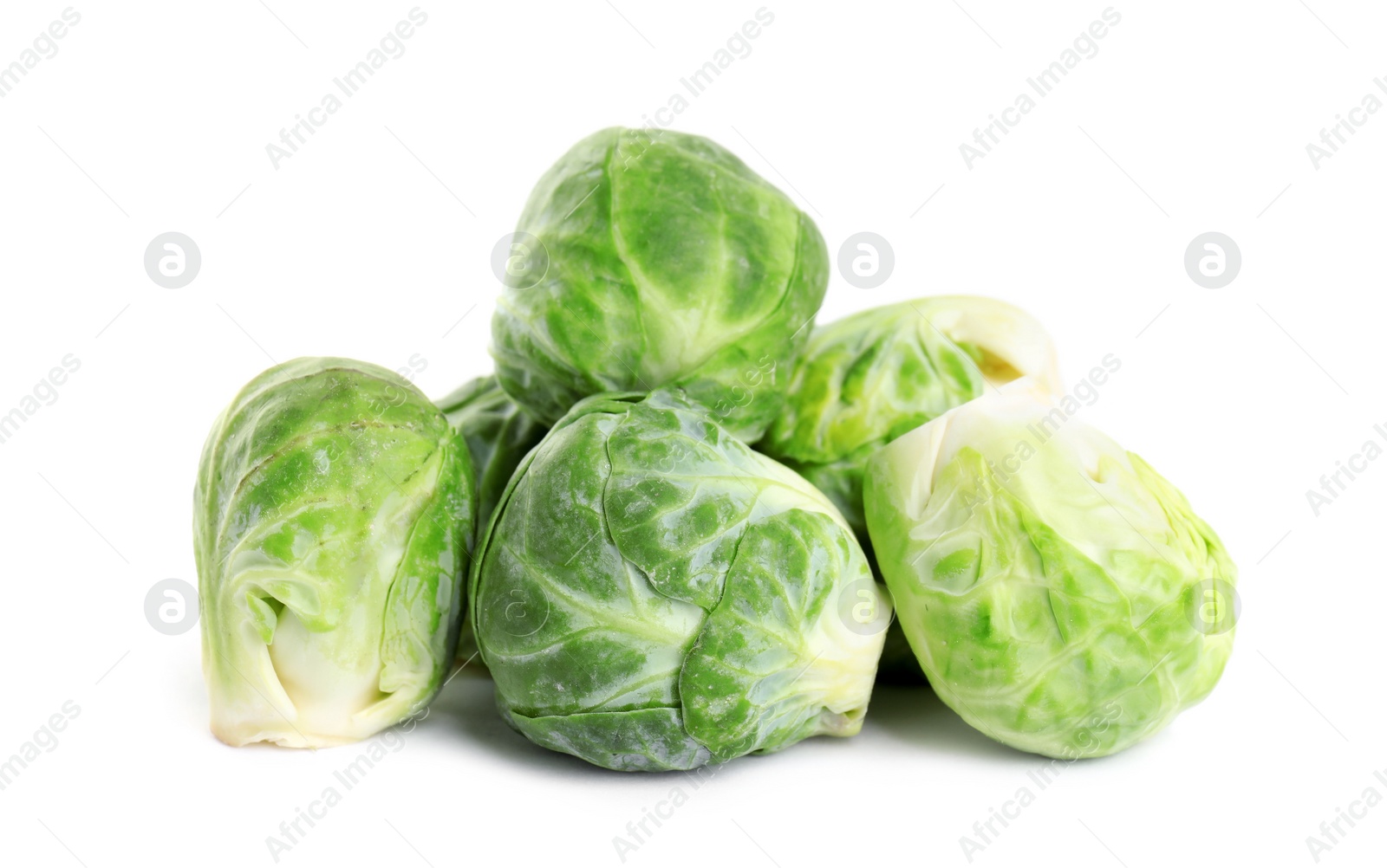 Photo of Pile of fresh Brussels sprouts isolated on white